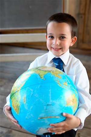 Boy in Schoolhouse with Globe Stock Photo - Rights-Managed, Code: 700-01173178