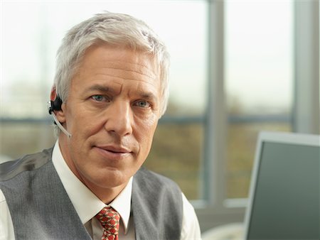 simsearch:700-01378659,k - Businessman Wearing Headset Stock Photo - Rights-Managed, Code: 700-01173232