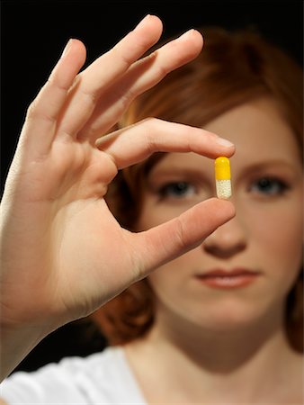 drugs (recreational) - Woman Holding Pill Stock Photo - Rights-Managed, Code: 700-01173267