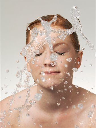 Woman Splashing Water onto Face Stock Photo - Rights-Managed, Code: 700-01173271