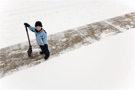 snow shovelling - Portrait of Boy Holding Shovel Stock Photo - Rights-Managed, Code: 700-01173388