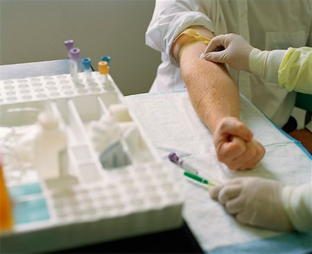 Doctor Taking Blood Sample from Man's Arm Stock Photo - Rights-Managed, Code: 700-01173501