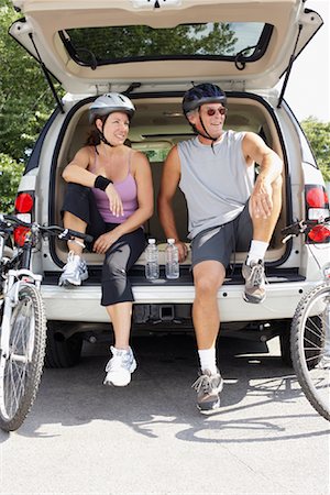 sitting on the tailgate - Couple Sitting in Vehicle Stock Photo - Rights-Managed, Code: 700-01173678