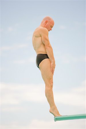 profile of person diving into pool - Man Diving Stock Photo - Rights-Managed, Code: 700-01184378