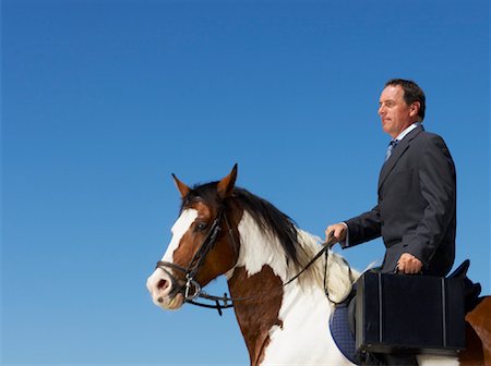 Businessman Riding Horse to Work Foto de stock - Direito Controlado, Número: 700-01185199