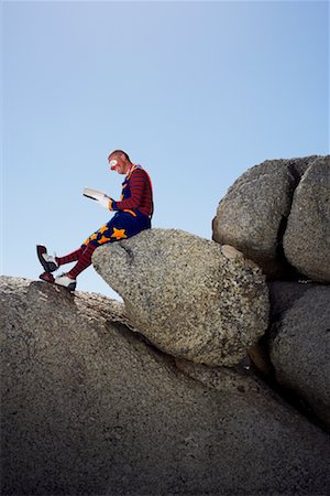 simsearch:700-01185206,k - Clown Reading Outdoors Stock Photo - Rights-Managed, Code: 700-01185207