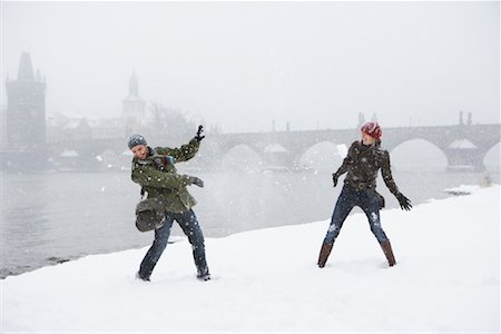 snow covered bridges and rivers - Couple Having Snowball Fight Stock Photo - Rights-Managed, Code: 700-01185286