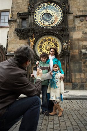 prague astronomical clock - Man Taking Family Portrait Stock Photo - Rights-Managed, Code: 700-01185727