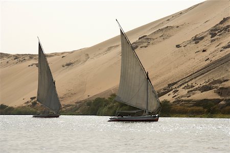 egyptian sailing on nile river - Feluccas on the Nile River, Aswan, Egypt Stock Photo - Rights-Managed, Code: 700-01182735