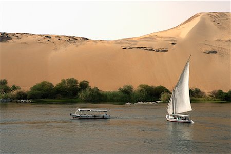 egyptian sailing on nile river - Feluccas on the Nile River, Aswan, Egypt Stock Photo - Rights-Managed, Code: 700-01182738