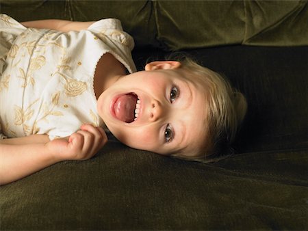 Little Girl Lying on Sofa Stock Photo - Rights-Managed, Code: 700-01182810