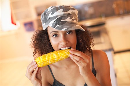 Portrait of Woman Eating Corn Stock Photo - Rights-Managed, Code: 700-01183179