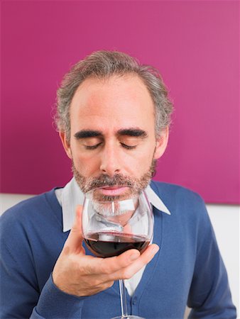 Man Inspecting Red Wine Fotografie stock - Rights-Managed, Codice: 700-01183911