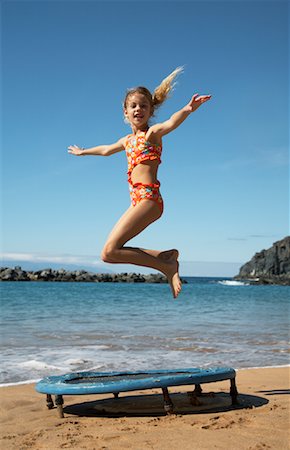 Girl Jumping on Trampoline Stock Photo - Rights-Managed, Code: 700-01183964