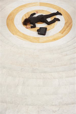 Businessman Lying at Bottom of Staircase Fotografie stock - Rights-Managed, Codice: 700-01194354