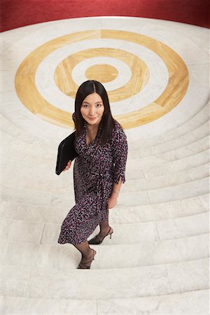 simsearch:700-01194372,k - Businesswoman Ascending Staircase Foto de stock - Con derechos protegidos, Código: 700-01194359