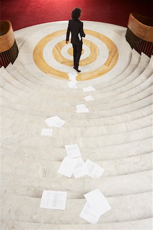 Businessman Dropping Papers while Descending Stairs Foto de stock - Con derechos protegidos, Código: 700-01194361