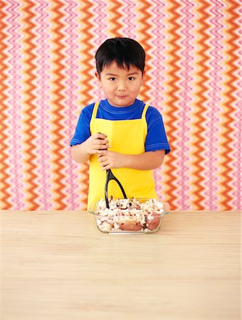 Portrait of Little Boy Mashing Potatoes Stock Photo - Rights-Managed, Code: 700-01194581