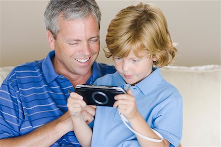 Père et fils, jeu vidéo Photographie de stock - Rights-Managed, Code: 700-01196170