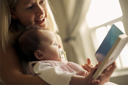 pacifier mom holding - Mother Reading to Baby Stock Photo - Rights-Managed, Code: 700-01199452