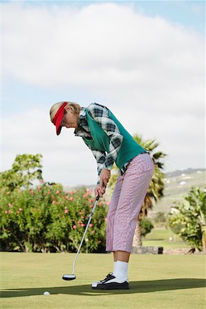 Woman Golfing Foto de stock - Con derechos protegidos, Código: 700-01199597