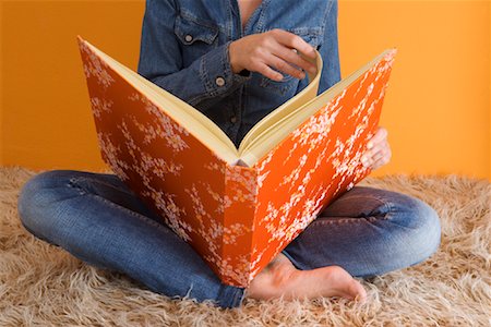 shag carpet - Woman Looking at Photo Album Stock Photo - Rights-Managed, Code: 700-01199837