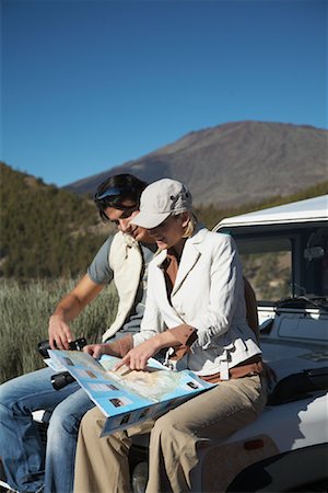 sitting car hood - Couple Sitting on Jeep Stock Photo - Rights-Managed, Code: 700-01199878