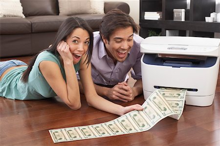 Couple Printing Money Stock Photo - Rights-Managed, Code: 700-01200204