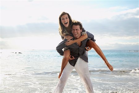 Man Giving Woman Piggyback Ride Stock Photo - Rights-Managed, Code: 700-01200447