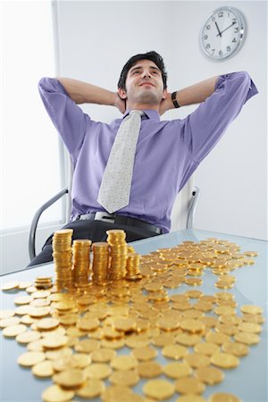 Businessman with Gold Coins Stock Photo - Rights-Managed, Code: 700-01224042