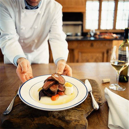 Chef Serving Meal Stock Photo - Rights-Managed, Code: 700-01223374