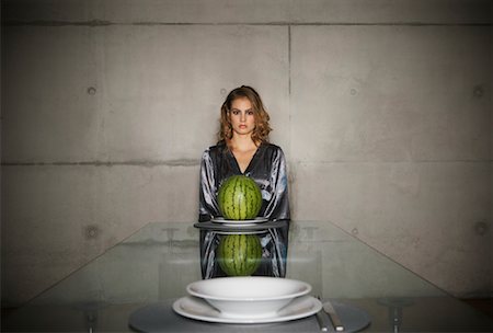 Woman at Dining Room Table with Watermelon Stock Photo - Rights-Managed, Code: 700-01223797
