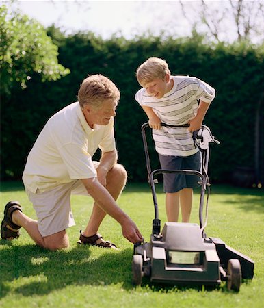 father child yard not illustration not business not vintage not 20s not 30s not 40s not 70s not 80s - Father Teaching Son to Mow Lawn Stock Photo - Rights-Managed, Code: 700-01234758