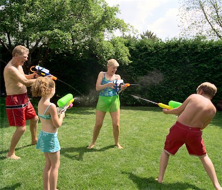 preteen one piece swimsuit - Water Fight Stock Photo - Rights-Managed, Code: 700-01234775