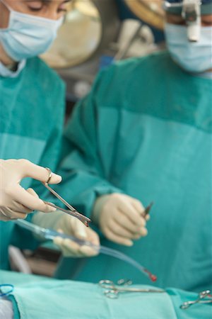 Doctors Performing Surgery Stock Photo - Rights-Managed, Code: 700-01234844