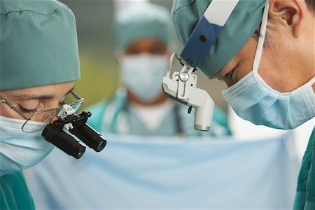 Doctors Performing Surgery Stock Photo - Rights-Managed, Code: 700-01234852