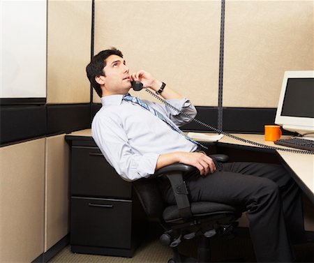 man bored in cubicle