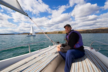 Man Sailing, Ghost Lake, Alberta, Canada Stock Photo - Rights-Managed, Code: 700-01248044