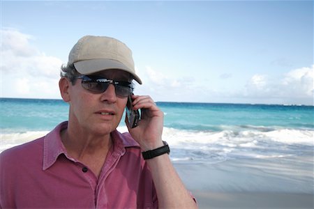 Man Using Cell Phone at Beach Stock Photo - Rights-Managed, Code: 700-01249080