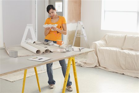 Woman Looking at Paint Samples Stock Photo - Rights-Managed, Code: 700-01249206