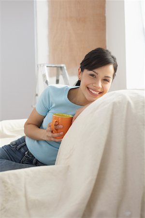 Woman on Sofa During Home Renovations Foto de stock - Con derechos protegidos, Código: 700-01249210