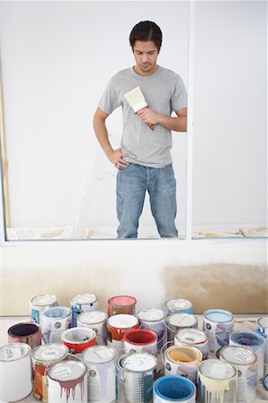 pic of man holding paint can and brush - Interior Decorator Looking over Paint Cans Stock Photo - Rights-Managed, Code: 700-01260527