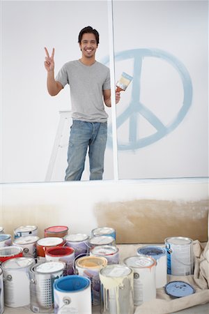 Interior Decorator Looking over Paint Cans Stock Photo - Rights-Managed, Code: 700-01260528