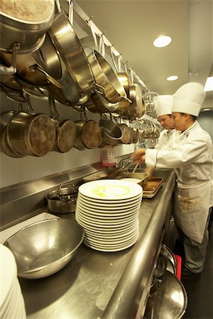 simsearch:700-02289662,k - Chefs Cooking in Kitchen Stock Photo - Rights-Managed, Code: 700-01275185