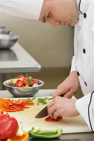 simsearch:614-09057167,k - Chef Chopping Vegetables Fotografie stock - Rights-Managed, Codice: 700-01275202