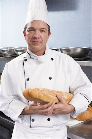 Chef Holding miche de pain Photographie de stock - Rights-Managed, Code: 700-01275225