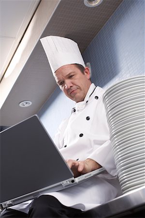 person typing restaurant - Chef Using Laptop Stock Photo - Rights-Managed, Code: 700-01275241