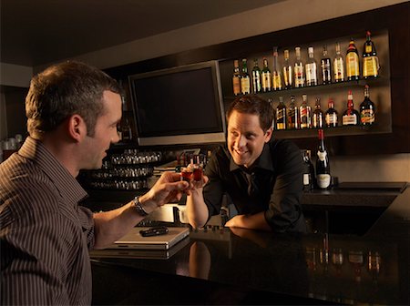 simsearch:600-02943485,k - Bartender and Customer Toasting Stock Photo - Rights-Managed, Code: 700-01275271