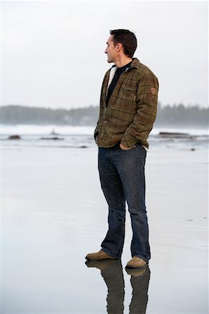 Man Looking into the Distance, Chesterman Beach, Tofino, British Columbia, Canada Stock Photo - Rights-Managed, Code: 700-01275438