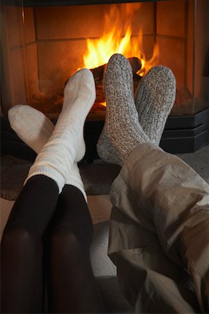 detail of fireplace in the inside of a home - Couple's Feet by Fireplace Stock Photo - Rights-Managed, Code: 700-01275928